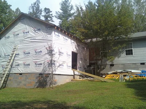 Tyvek wrapped gable on a new room addition beside an existing home in Moses Lake